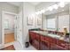 Elegant bathroom with a double vanity, granite countertop, and stylish fixtures, perfect for modern living at 1069 Westlake Dr, Kannapolis, NC 28081