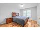 Cozy bedroom with hardwood floors, a ceiling fan, and a comfortable bed, ideal for relaxation at 1069 Westlake Dr, Kannapolis, NC 28081