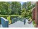 Relaxing backyard deck with comfortable lounge chair and scenic views of the surrounding greenery at 1069 Westlake Dr, Kannapolis, NC 28081