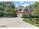 Brick home with a two-car garage and well-maintained landscaping and a long concrete driveway at 1069 Westlake Dr, Kannapolis, NC 28081