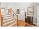 Entryway with hardwood floors, staircase, decorative mirror and flowers at 1069 Westlake Dr, Kannapolis, NC 28081