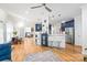 Open concept kitchen with stainless steel appliances, hardwood floors, breakfast bar, and adjacent living area at 1069 Westlake Dr, Kannapolis, NC 28081