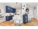 Stylish kitchen with bar seating, modern pendant lights, and updated appliances at 1069 Westlake Dr, Kannapolis, NC 28081