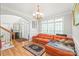Bright living room featuring hardwood floors, chandelier, and large windows at 1069 Westlake Dr, Kannapolis, NC 28081