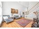 Inviting living room with a cozy seating arrangement, staircase and beautiful hardwood floors at 1069 Westlake Dr, Kannapolis, NC 28081