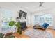 Bright living room featuring a fireplace, hardwood floors, and large windows, providing a cozy atmosphere at 1069 Westlake Dr, Kannapolis, NC 28081