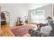 Elegant living room with hardwood floors, large arched windows, and classic furnishings at 1069 Westlake Dr, Kannapolis, NC 28081