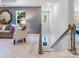 Upstairs hallway with a staircase, stylish furniture, and good natural light from outdoor windows at 1132 Old Trade St, Edgemoor, SC 29712