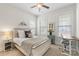 Cozy bedroom with natural light, a ceiling fan, and desk area at 11806 Stirling Field Dr, Pineville, NC 28134