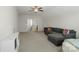 Large bonus room with a cozy sectional, bed, and easy access to an adjacent bathroom at 11806 Stirling Field Dr, Pineville, NC 28134