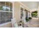 Cozy front porch featuring rocking chairs, creating a relaxing outdoor space at 11806 Stirling Field Dr, Pineville, NC 28134