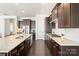 Spacious kitchen with a central island, modern appliances, and ample countertop space at 11806 Stirling Field Dr, Pineville, NC 28134