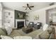 Comfortable living room with a fireplace, built-in shelving, and stylish decor at 11806 Stirling Field Dr, Pineville, NC 28134