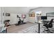 Workout room with exercise bike, desk, and window offering natural light at 11806 Stirling Field Dr, Pineville, NC 28134