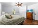 Spacious bedroom with hardwood floors, a large closet, and a traditional wooden dresser with television at 1210 Jackson Rd, Gastonia, NC 28052
