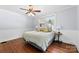 Bright bedroom features hardwood floors, soft blue walls, and natural light from two large windows at 1210 Jackson Rd, Gastonia, NC 28052
