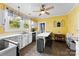Bright, yellow kitchen featuring modern appliances, tile floors, and ample counter space, ideal for cooking and gathering at 1210 Jackson Rd, Gastonia, NC 28052