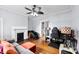 Living room with fireplace, hardwood floors and gray sofa at 1210 Jackson Rd, Gastonia, NC 28052