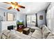 Cozy living room featuring a fireplace, hardwood floors, and a comfortable sectional sofa, creating an inviting space at 1210 Jackson Rd, Gastonia, NC 28052