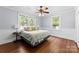 Bedroom with wood floors, white walls and multiple windows at 1210 Jackson Rd, Gastonia, NC 28052