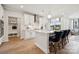 Stylish kitchen with white cabinets, a central island, and a view of the living area at 1225 Margo Mannor Dr, Fort Mill, SC 29708