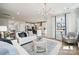 Bright, open living room with modern furniture, white walls, and seamless flow into the kitchen at 1225 Margo Mannor Dr, Fort Mill, SC 29708