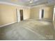 Spacious bedroom with tray ceilings and multiple entry ways at 13419 Morgan Lee Ave, Charlotte, NC 28213