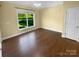 Bright bedroom with hardwood floors, a large window, and neutral-toned walls at 13419 Morgan Lee Ave, Charlotte, NC 28213