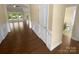 Entryway featuring dark wood floors, paneled walls and trim, and an open floorplan at 13419 Morgan Lee Ave, Charlotte, NC 28213