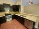 Beautiful kitchen featuring dark cabinetry, stainless steel appliances, and granite countertops at 13419 Morgan Lee Ave, Charlotte, NC 28213