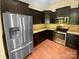 Well-equipped kitchen featuring stainless steel appliances, including a refrigerator, oven, and microwave at 13419 Morgan Lee Ave, Charlotte, NC 28213