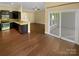 Open-concept living area with a view of the kitchen and the sliding doors to a patio at 13419 Morgan Lee Ave, Charlotte, NC 28213