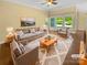 Bright living room with large windows and plush seating arrangement at 13419 Morgan Lee Ave, Charlotte, NC 28213