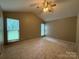 Large bedroom with vaulted ceilings and multiple windows for natural light at 156 Tarrington Dr, Statesville, NC 28625