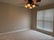 Neutral bedroom with carpet, ceiling fan and a window that provides natural light at 156 Tarrington Dr, Statesville, NC 28625