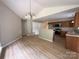Open dining area with modern lighting at 156 Tarrington Dr, Statesville, NC 28625
