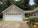 Spacious detached two-car garage with a well-maintained exterior at 156 Tarrington Dr, Statesville, NC 28625