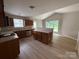 Well-lit kitchen featuring an island, wood cabinets, and stainless steel appliances at 156 Tarrington Dr, Statesville, NC 28625