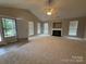 Bright and spacious living room with vaulted ceilings, fireplace, and lots of windows at 156 Tarrington Dr, Statesville, NC 28625