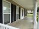 Inviting front porch featuring black shutters and decorative columns at 156 Tarrington Dr, Statesville, NC 28625