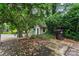 Backyard featuring a magnolia tree, picket fence, and partial view of a backyard cottage at 1609 Begonia Way, Rock Hill, SC 29732