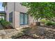 Backyard with patio featuring a blooming magnolia tree, sidewalk, and privacy fence at 1609 Begonia Way, Rock Hill, SC 29732