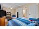 Bedroom features a bed, ceiling fan, and view into an adjacent bathroom, and a treadmill at 1609 Begonia Way, Rock Hill, SC 29732