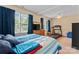 Spacious bedroom with a cozy bed, dresser with TV, and a treadmill near the bright windows at 1609 Begonia Way, Rock Hill, SC 29732