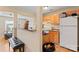 Functional kitchen with wood cabinets, a breakfast bar, and easy access to the living area at 1609 Begonia Way, Rock Hill, SC 29732