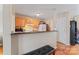 Cozy kitchen featuring wooden cabinets, a breakfast bar, and essential appliances at 1609 Begonia Way, Rock Hill, SC 29732