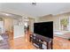 Cozy living room open to the kitchen, featuring hardwood floors and a staircase at 1609 Begonia Way, Rock Hill, SC 29732