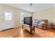 Bright living room featuring hardwood floors, a large window, and a comfortable couch at 1609 Begonia Way, Rock Hill, SC 29732
