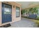Inviting covered front porch featuring a cozy swing and a ceiling fan for relaxation at 1609 Begonia Way, Rock Hill, SC 29732