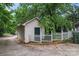 Detached one car garage/shed featuring white siding, green door, and picket fence at 1609 Begonia Way, Rock Hill, SC 29732